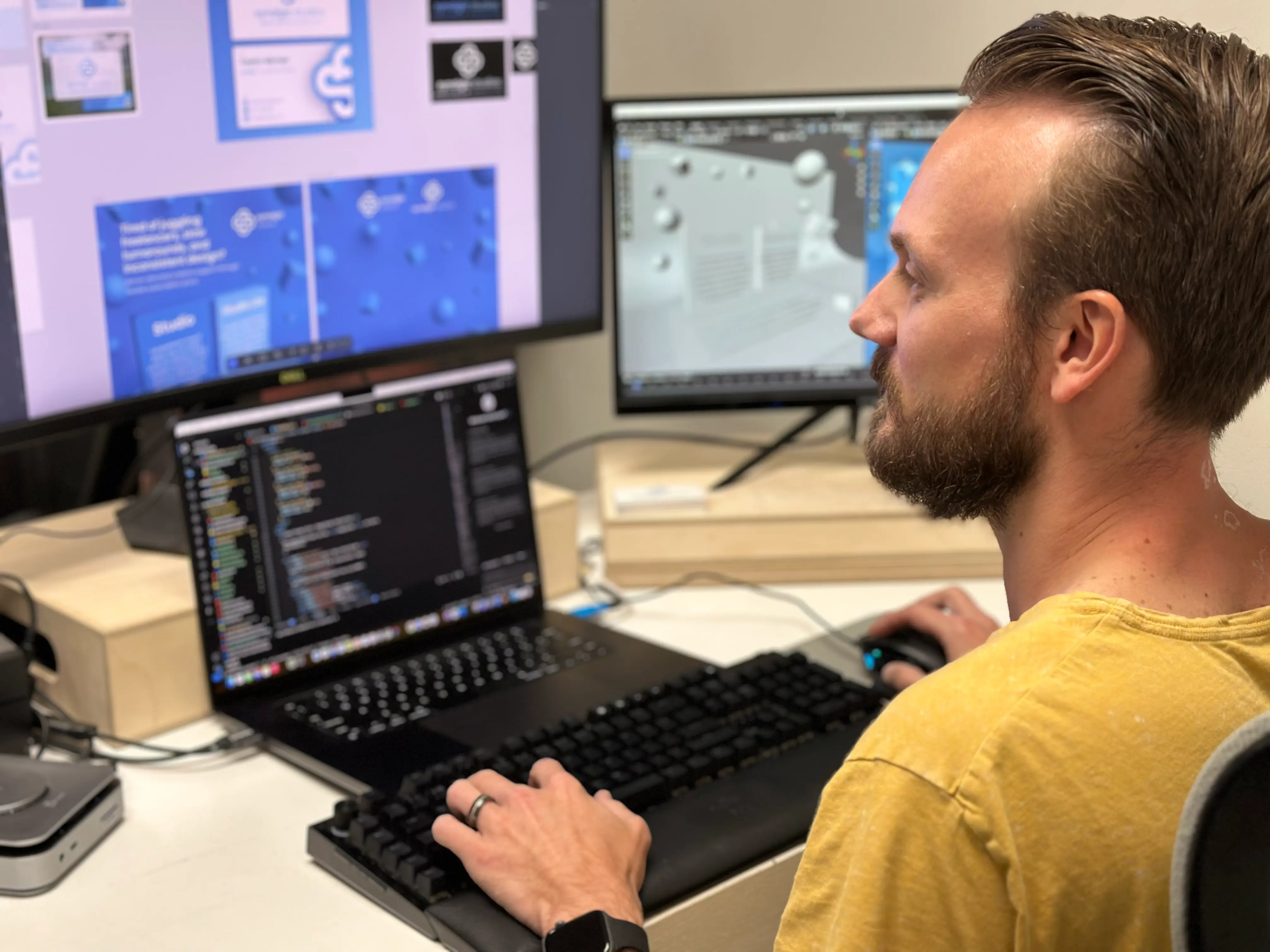 Synalgic Studios founder working across design and development screens.